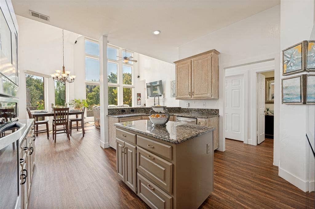 8524 Wellington Point Drive, Irving, TX 75063 Kitchen featuring a central island with storage, and granite countertops