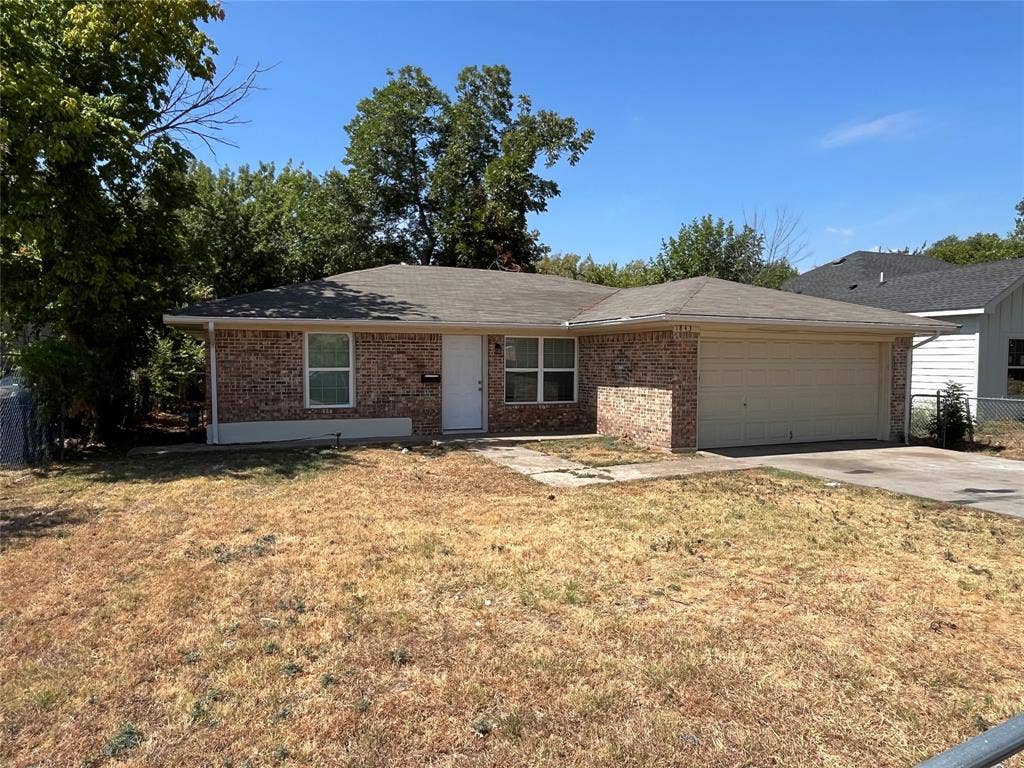 1843 Greendale Drive, Dallas, TX 75217 Brick exterior with a single-car garage, concrete driveway, and a shingled roof