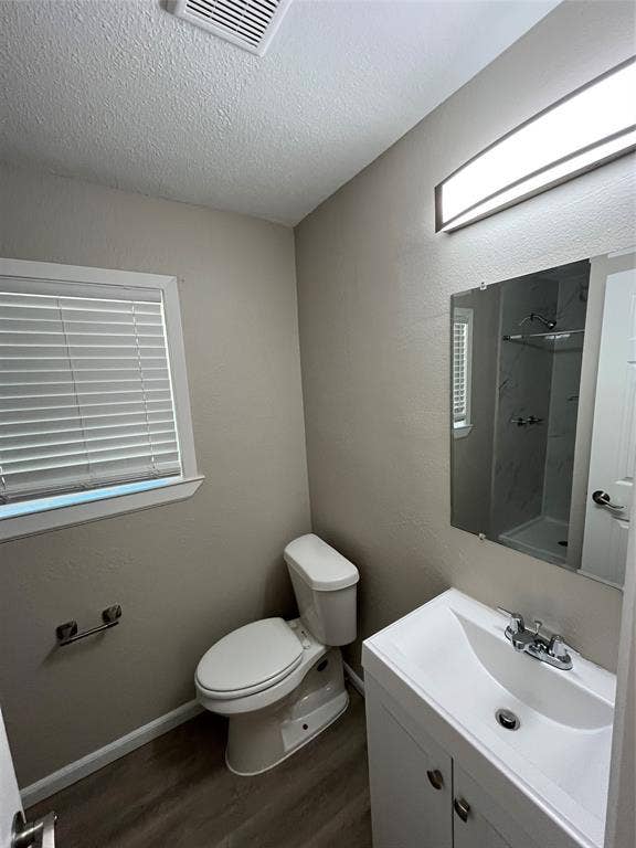 1843 Greendale Drive, Dallas, TX 75217 Built-in vanity with integrated sink, chrome faucet, and mirrored medicine cabinet