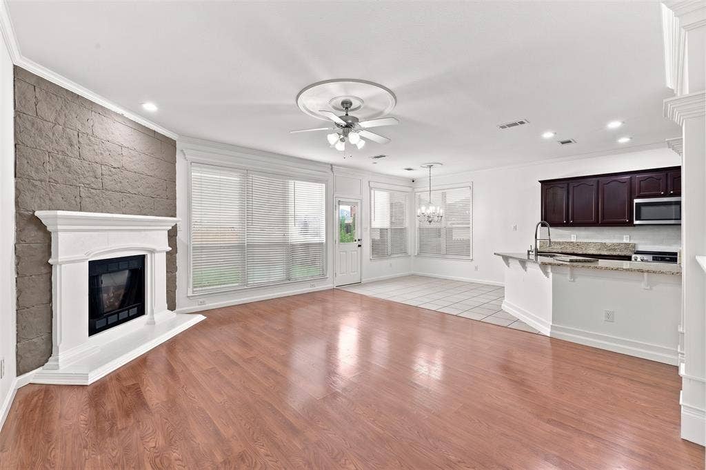 6427 Miranda Drive, Fort Worth, TX 76131 Large open living room with laminate wood floors.