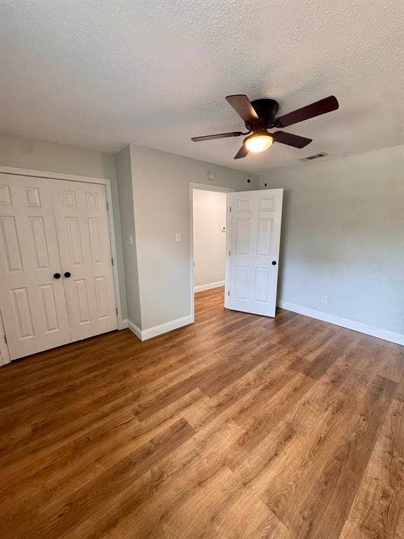 624 E 3rd Street, #202, Springtown, TX 76082 Wood-finish flooring, ceiling fan with integrated lighting, paneled doors, and light-toned wall paint