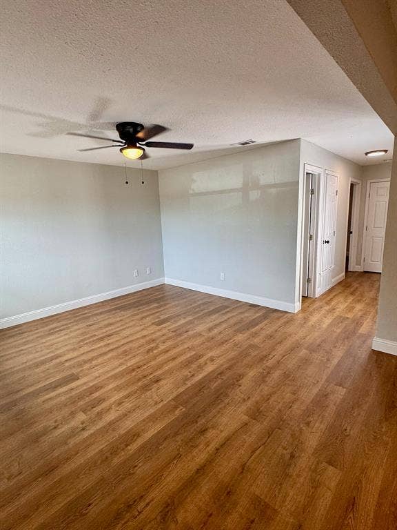 624 E 3rd Street, #202, Springtown, TX 76082 Wood-finish flooring throughout, ceiling fan with integrated lighting, recessed lighting, and white baseboards