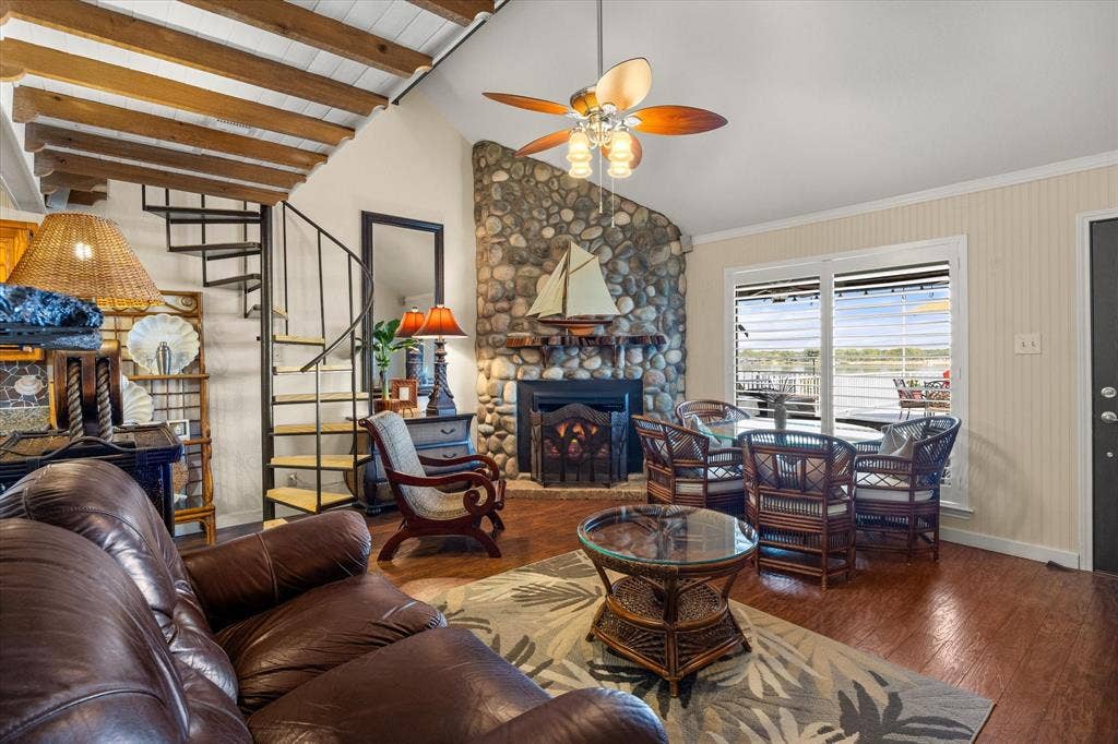 6606 Carol Court, Granbury, TX 76048 Living Room, with fireplace and staircase leading to 2nd Bedroom