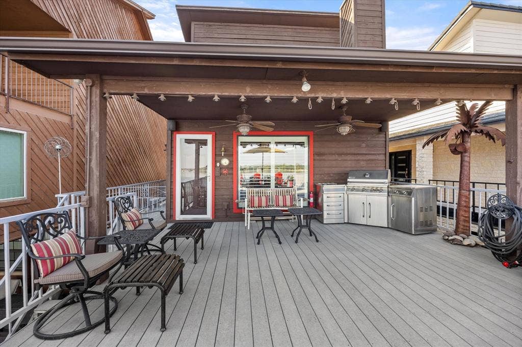 6606 Carol Court, Granbury, TX 76048 View of main level deck, with door leading to living area. BBQ grill stays, as well!