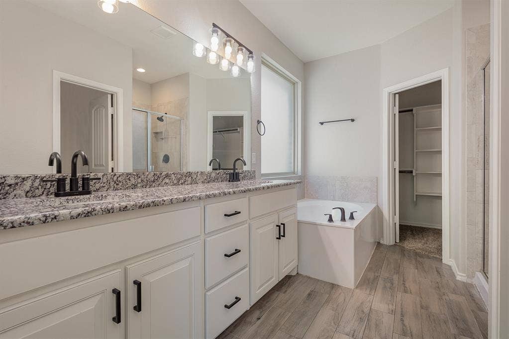 928 Dove Cove, Argyle, TX 76226 Features granite countertops, dual sink, separate shower from garden tub, walk-in closet