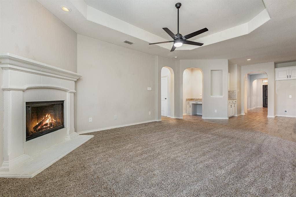 928 Dove Cove, Argyle, TX 76226 Great room view of living room with built-in desk area, and kitchen's dry bar that may be used as coffee station.