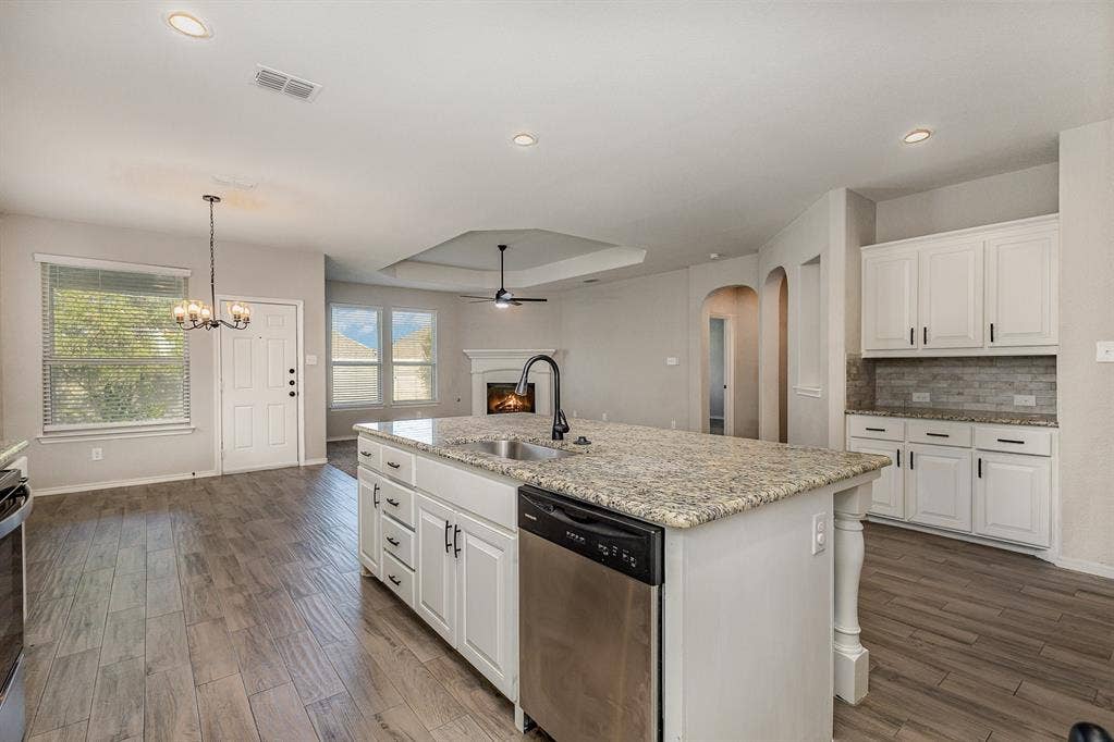 928 Dove Cove, Argyle, TX 76226 Open floorplan. View of great room: kitchen, dining area and living room