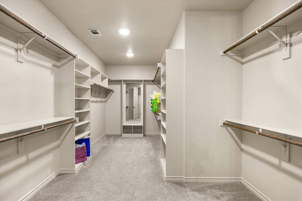 Primary closet with storage galore!!