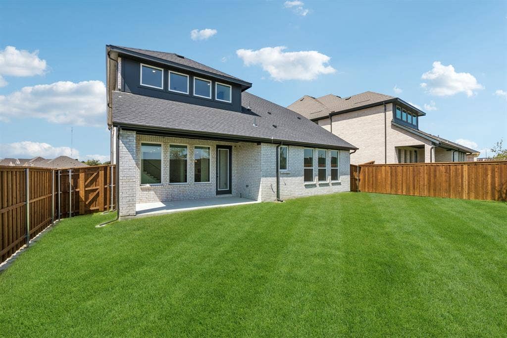 2312 Wispy Lane, Celina, TX 75009 With a large fenced yard and lovely covered patio, everyone will enjoy weekend bbq's in this fantastic back yard!