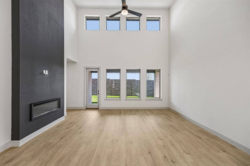 2308 Wispy Lane, Celina, TX 75009 Dual story windows flood this family room with natural light!