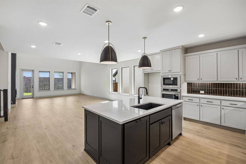 2308 Wispy Lane, Celina, TX 75009 The chef will never be left out of the party in this fantastic open concept home.