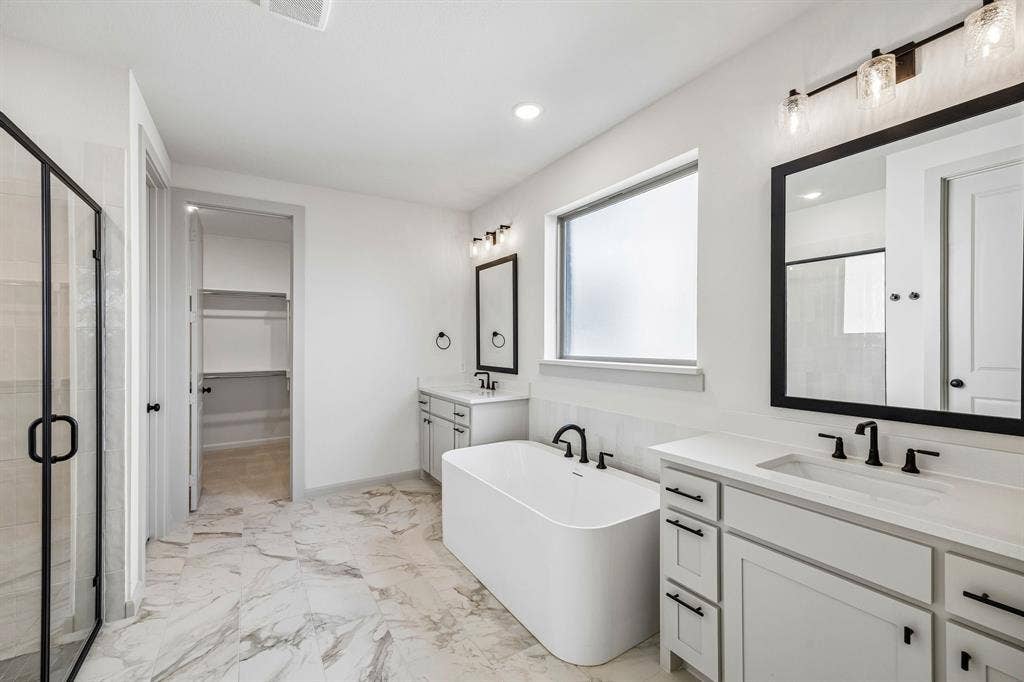 2308 Wispy Lane, Celina, TX 75009 Filled with style and offering plenty of room for two, this owner's bath is the perfect place to start or end your day!