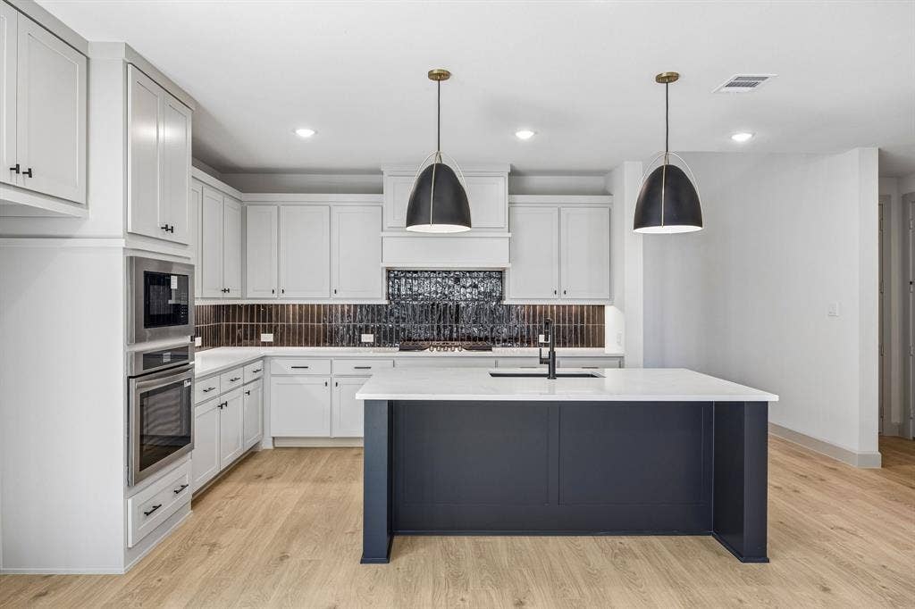 2308 Wispy Lane, Celina, TX 75009 The spacious kitchen island offer the ideal gathering place for friends and family!