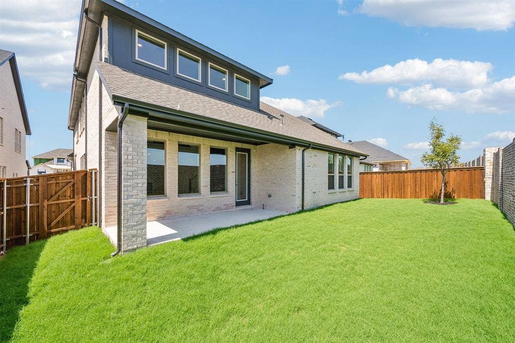 2308 Wispy Lane, Celina, TX 75009 Offering a private fenced back yard with lovely covered patio, the entire family will enjoy plenty of outdoor summertime fun in this wonderful space!