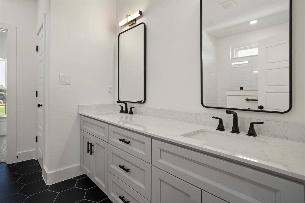 200 Cliff Court, Godley, TX 76044 Bathroom featuring tile patterned flooring and dual bowl vanity