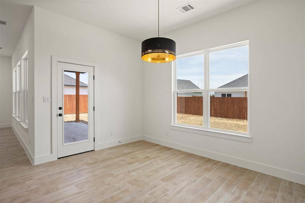 200 Cliff Court, Godley, TX 76044 Spare room featuring light wood-type flooring