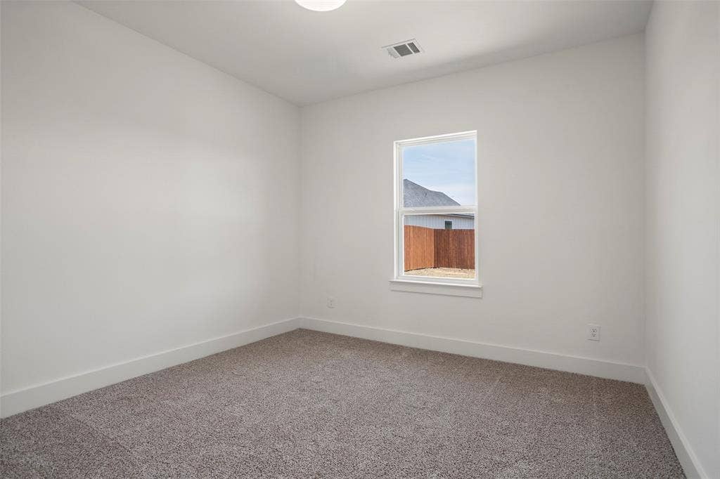 200 Cliff Court, Godley, TX 76044 Empty room with carpet floors