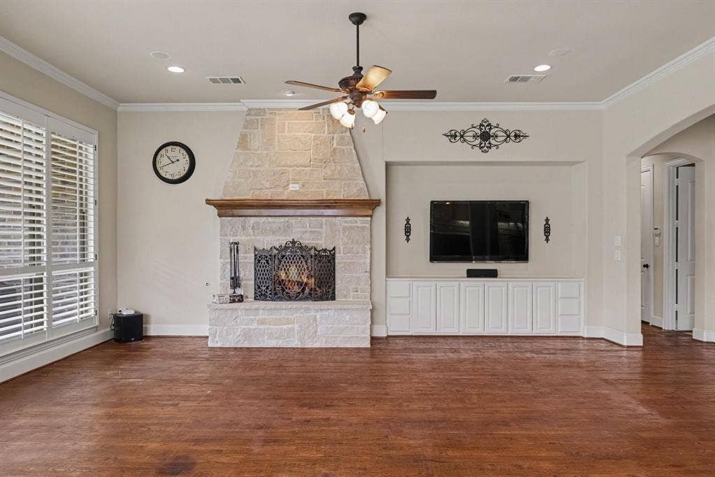408 Blue Ridge Court, Allen, TX 75013 Stone fireplace with a wood mantel