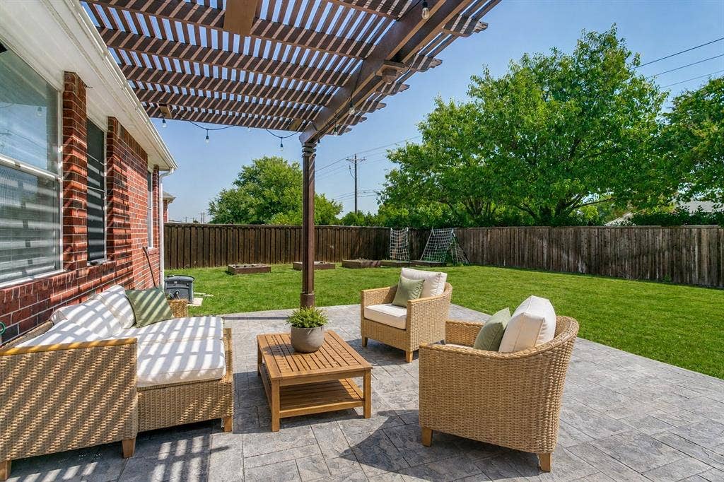 9604 Bull Creek Drive, Plano, TX 75025 Outdoor patio with a slatted pergola, string lighting, and stamped concrete flooring