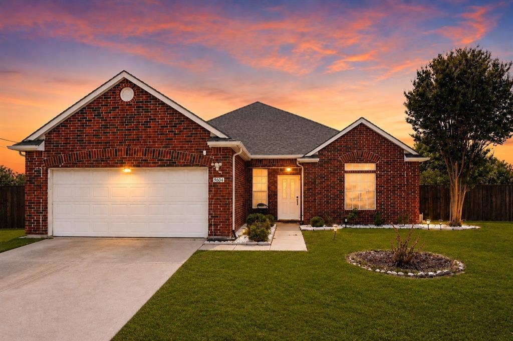 9604 Bull Creek Drive, Plano, TX 75025 Brick exterior with an attached two-car garage