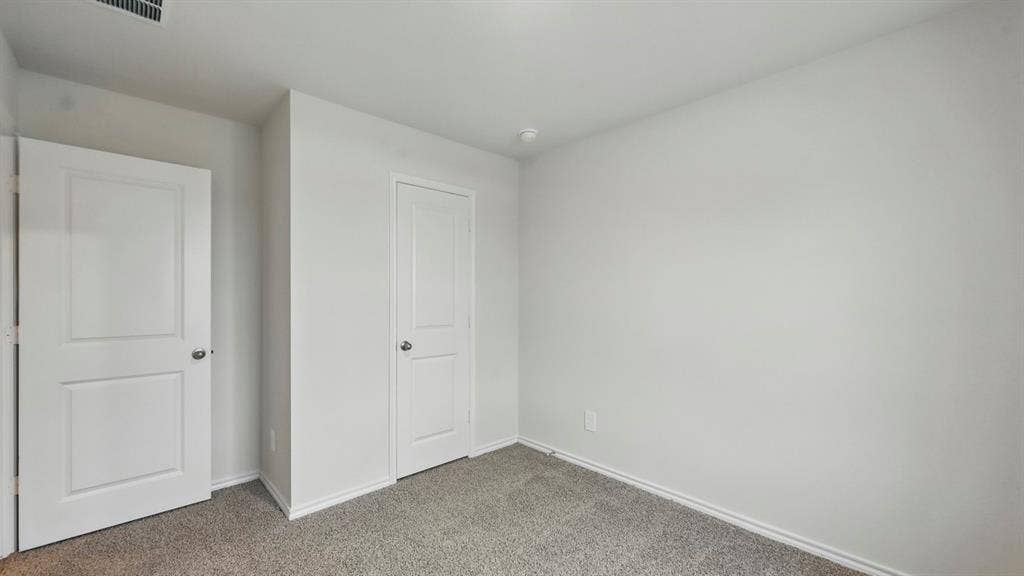 1912 Freeman Street, Tyler, TX 75702 Carpeted flooring, white interior doors, and neutral wall finishes