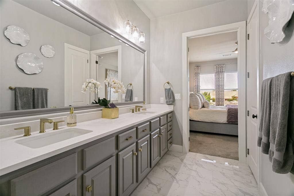 610 Via Ravello, #406, Irving, TX 75039 Primary Bathroom includes an oversized walk-in closet with a custom system.
