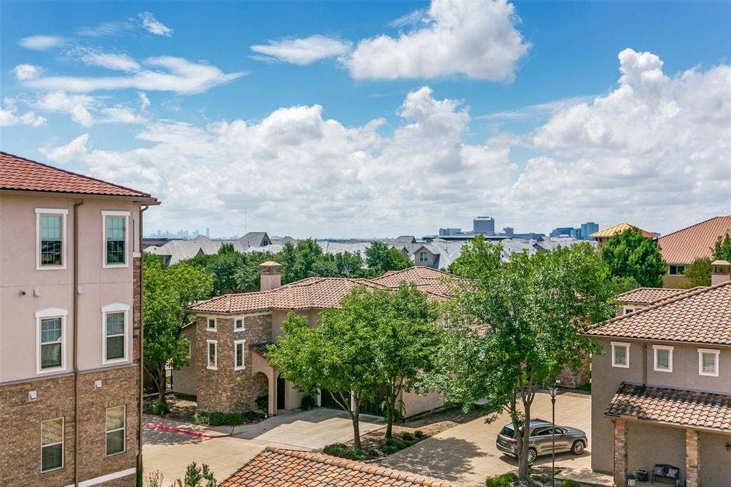 610 Via Ravello, #406, Irving, TX 75039 Views of both Downtown Dallas and Lake Carolyn from your private balcony