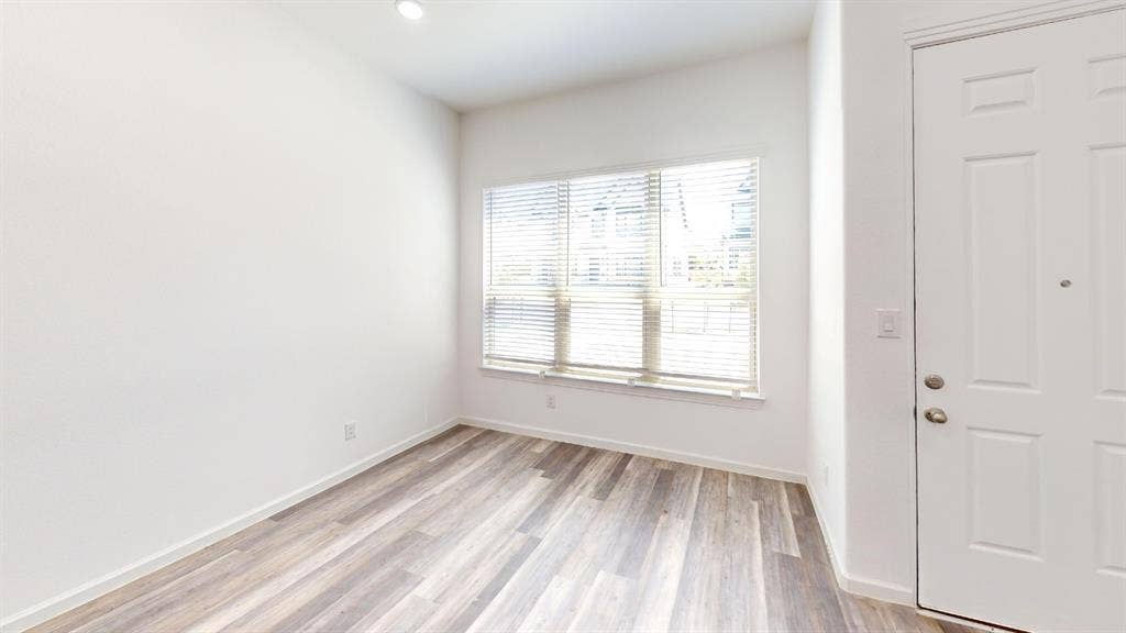366 Buck Ridge Drive, Frisco, TX 75068 Wood-finish flooring, recessed lighting, and a paneled entry door