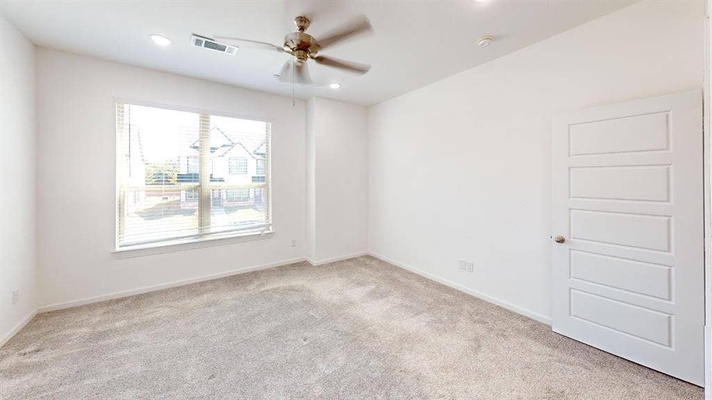 366 Buck Ridge Drive, Frisco, TX 75068 Carpeted room featuring a ceiling fan, recessed lighting, a window with blinds, and a paneled door