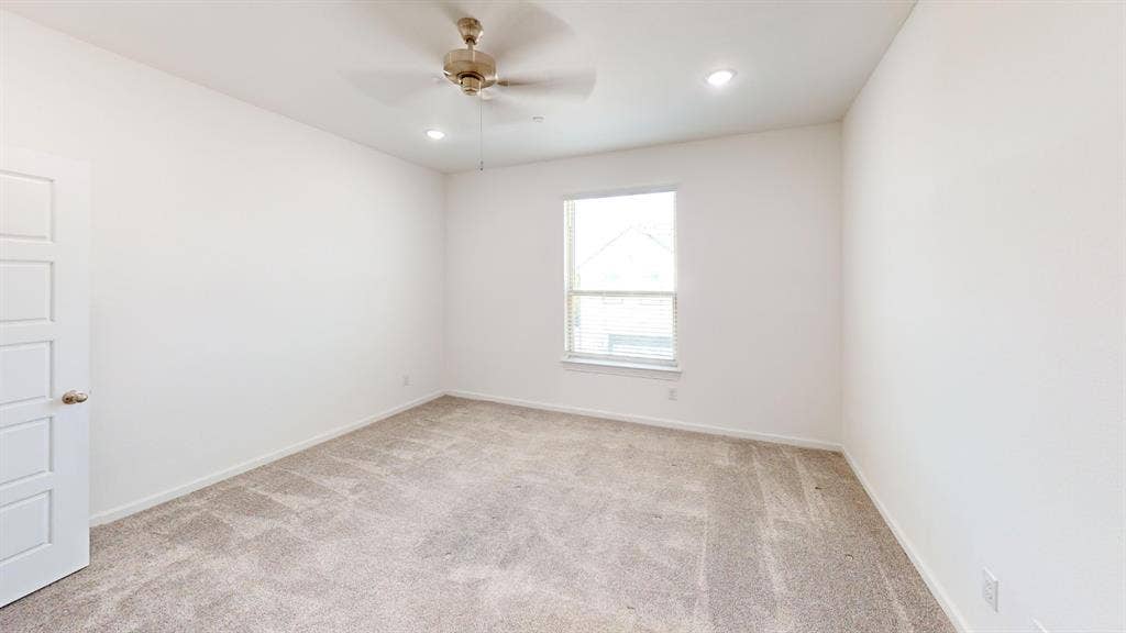 366 Buck Ridge Drive, Frisco, TX 75068 Neutral tone carpet, recessed ceiling lighting, ceiling fan, and a paneled door