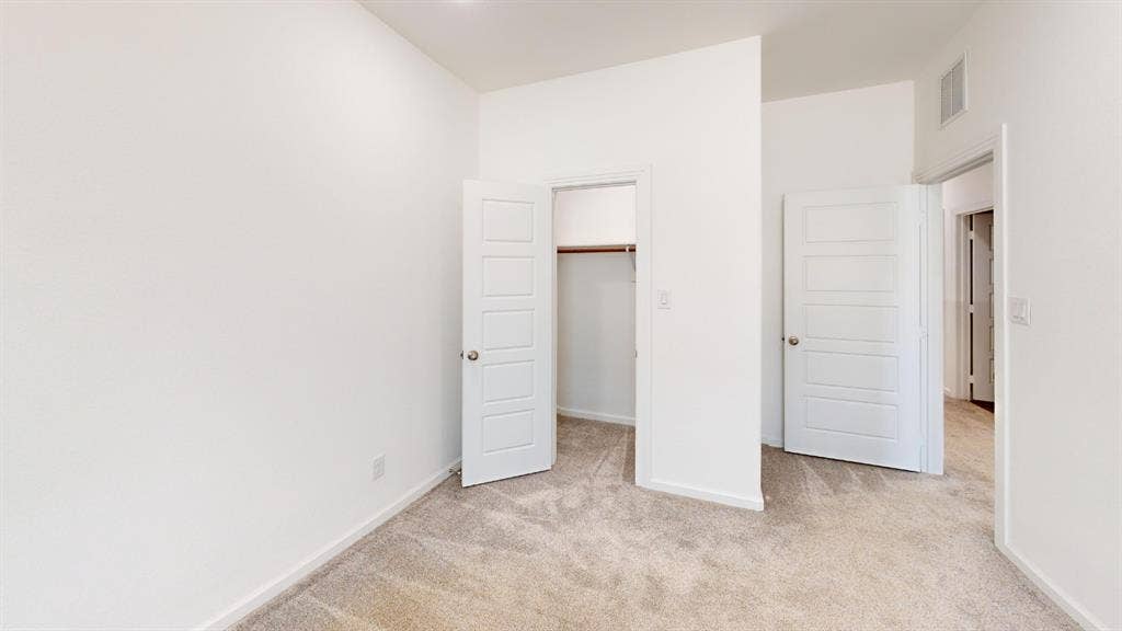 366 Buck Ridge Drive, Frisco, TX 75068 Neutral-toned carpeting, white walls, and a recessed ceiling light
