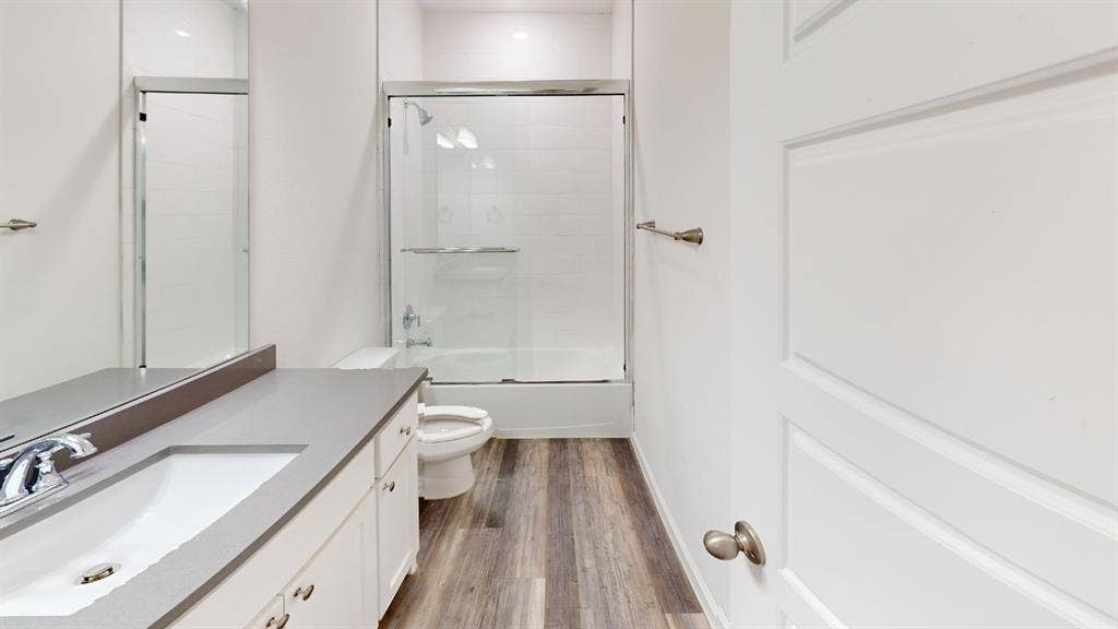 366 Buck Ridge Drive, Frisco, TX 75068 Vanity with integrated sink, chrome faucet, gray countertop, and white cabinetry
