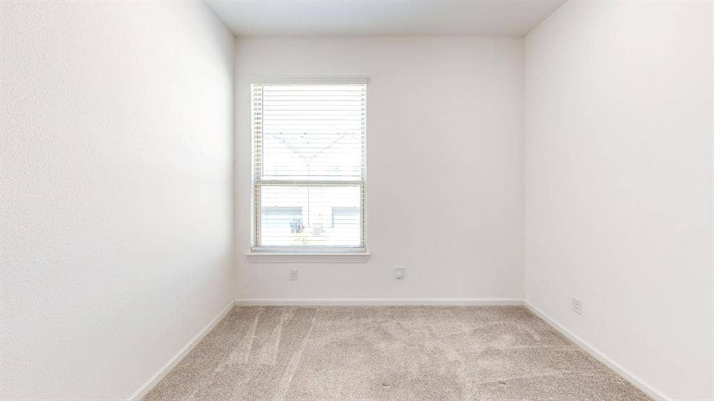 366 Buck Ridge Drive, Frisco, TX 75068 Neutral wall finishes, light-toned carpeting, and a window with blinds