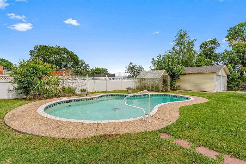 2967 S Old Robinson Road, Robinson, TX 76655 Views of the inground pool SOLD AS-IS, greenhouse, and detached garage