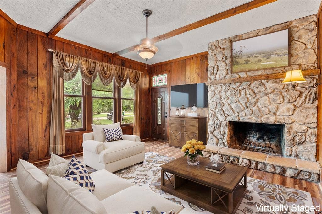 2967 S Old Robinson Road, Robinson, TX 76655 Cozy family/den area with large windows and floor-to-ceiling stone woodburning fireplace (Virtually Staged)