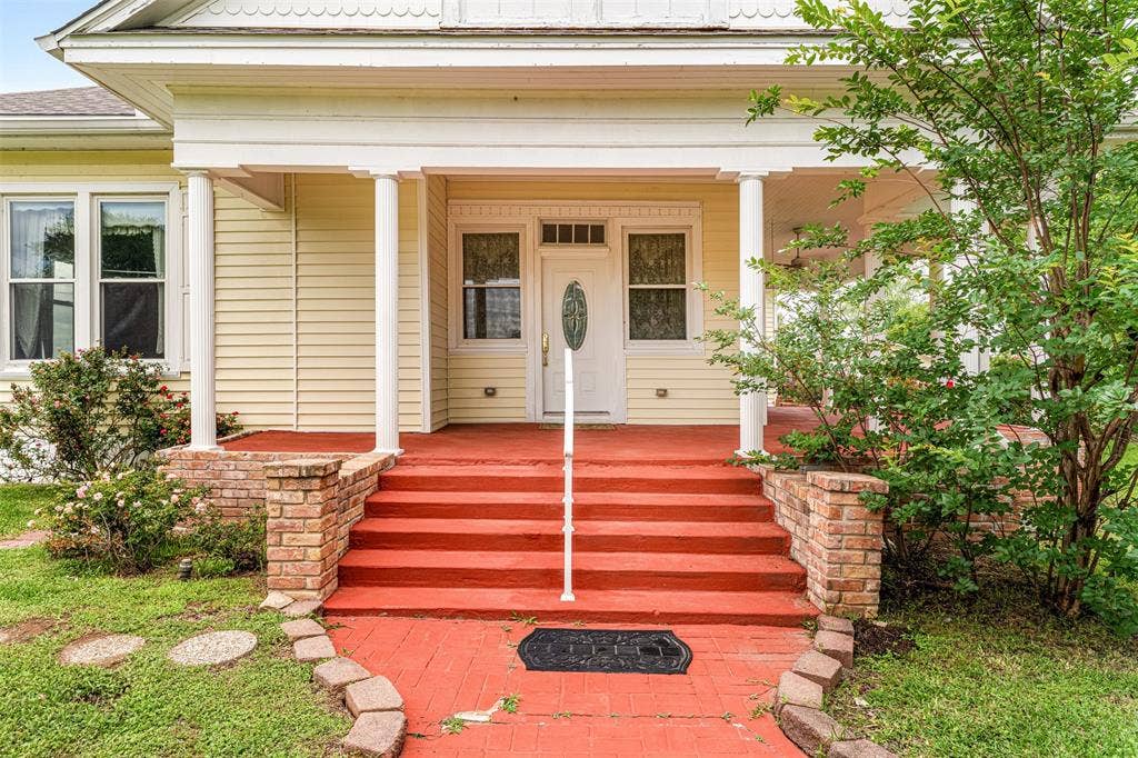 2967 S Old Robinson Road, Robinson, TX 76655 Front View entrance of the home with grand steps/rails onto the wraparound porch