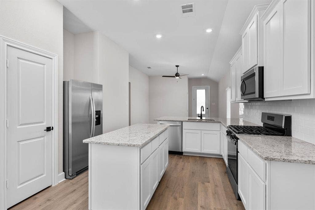 602 Princeton Heights Boulevard, Princeton, TX 75407 All kitchen Whirlpool® appliances are included.