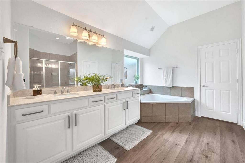 Dual vanity with white cabinetry, light-toned countertop, and undermount sinks