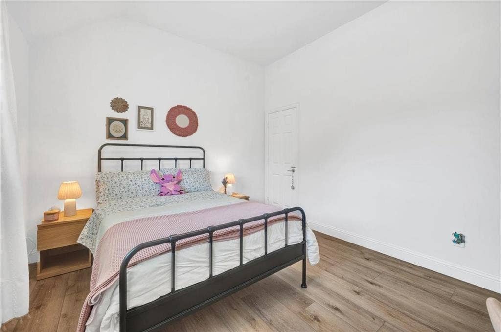 Vaulted ceiling with wood-finish flooring