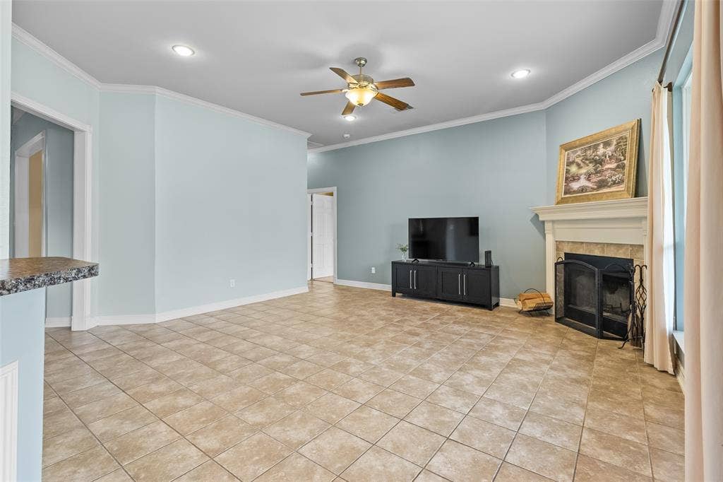11848 County Road 167, Tyler, TX 75703 Spacious interior featuring tile flooring, a fireplace with a mantel, recessed lighting, and a ceiling fan