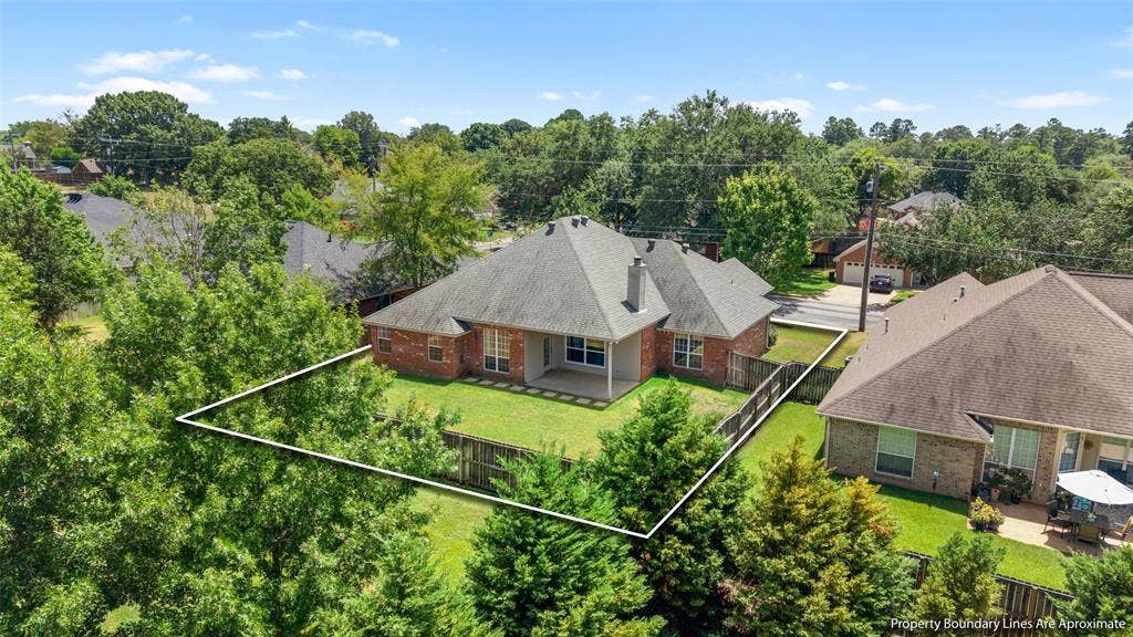 11848 County Road 167, Tyler, TX 75703 Brick exterior with a covered patio and fenced backyard