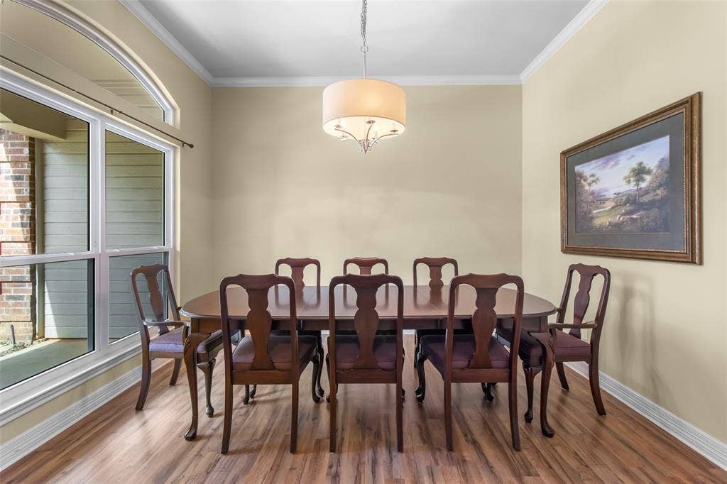 11848 County Road 167, Tyler, TX 75703 Wood-finish flooring, crown molding, and a large arched window