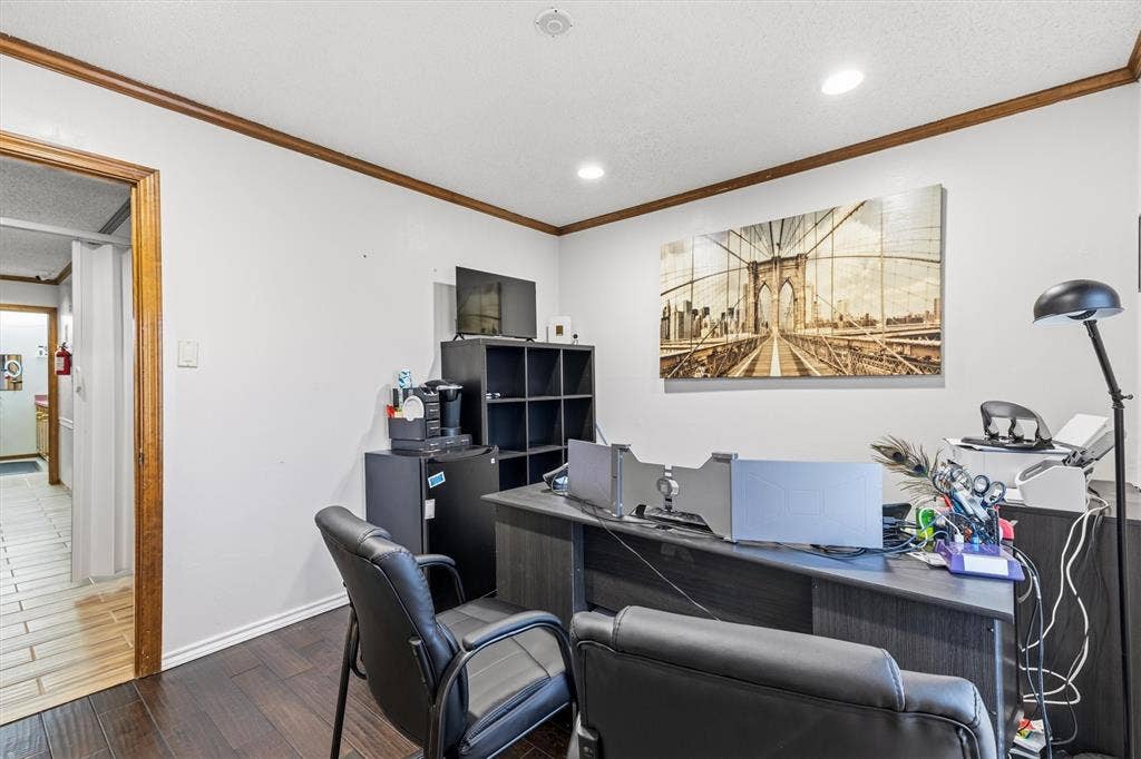 1055 W Pioneer Parkway, Grand Prairie, TX 75051 Recessed lighting, wood-finish flooring, wood trim, white walls, and a built-in shelving unit