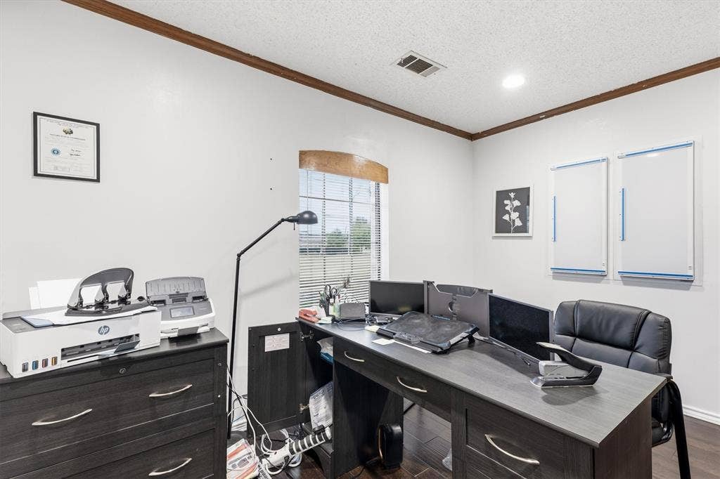 1055 W Pioneer Parkway, Grand Prairie, TX 75051 Recessed ceiling lighting, wood-finish flooring, and a window with horizontal blinds