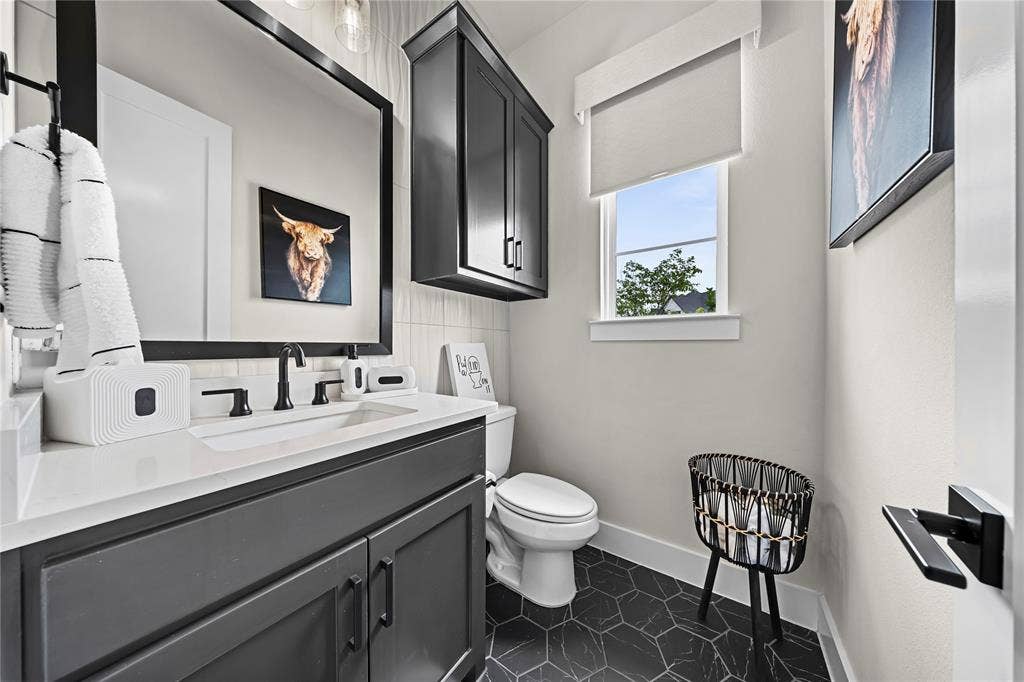 467 Mayfair Lane, Frisco, TX 75033 Vanity with an integrated sink, quartz-finish countertop, and matte black hardware