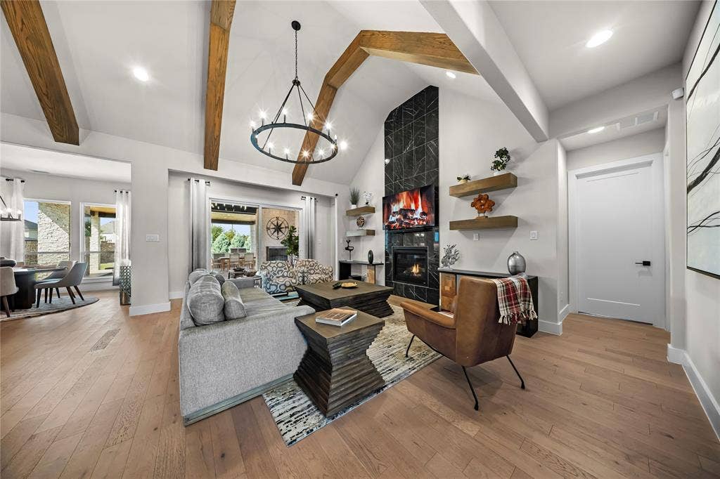 467 Mayfair Lane, Frisco, TX 75033 Vaulted ceiling with exposed wood beams and chandelier