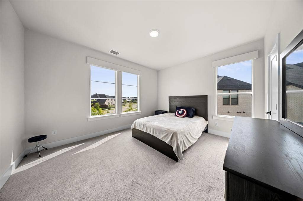 467 Mayfair Lane, Frisco, TX 75033 Recessed lighting, large windows, light-toned carpeting, white walls, and white trim