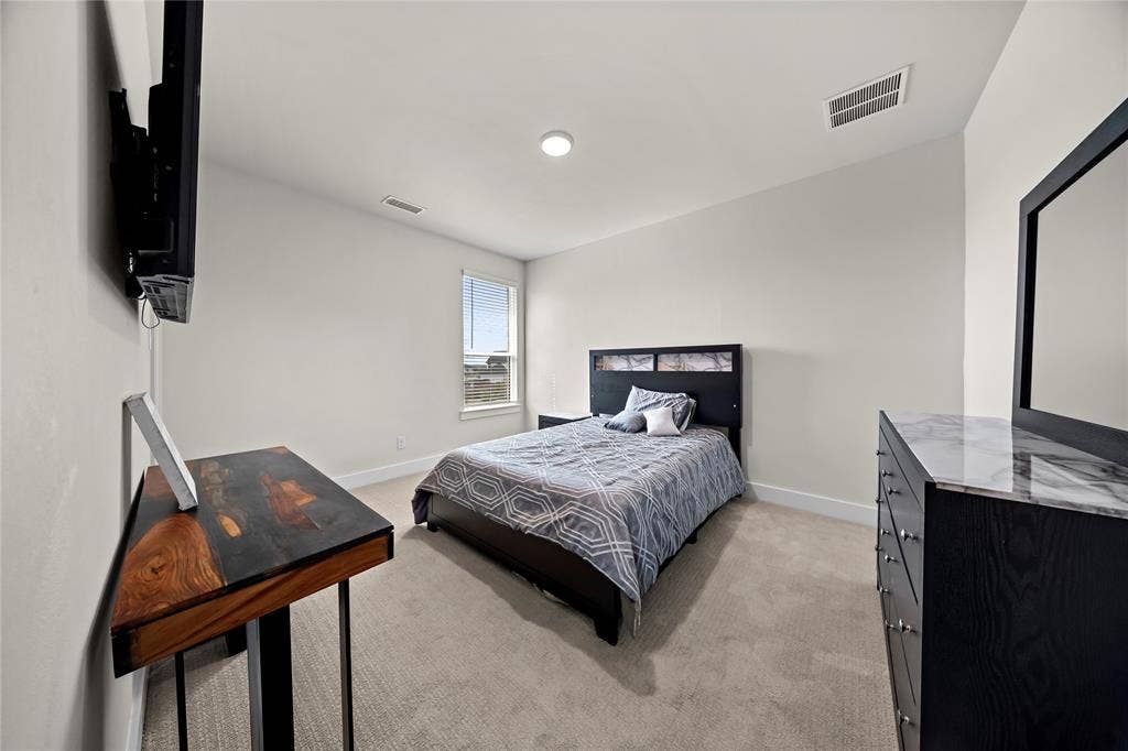 467 Mayfair Lane, Frisco, TX 75033 Plush carpeting, recessed lighting, and a window with blinds