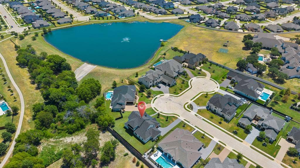 1561 Saint Peter, Prosper, TX 75078 Aerial perspective highlighting a cul-de-sac location with a nearby water feature and surrounding residences