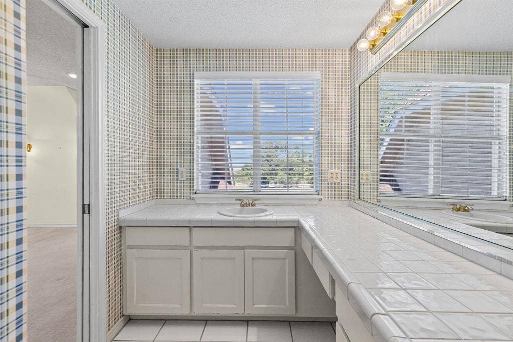 1200 County Road 2307, Sulphur Springs, TX 75482 Ensuite bath for bedroom 4 has large vanity, walk-in shower.